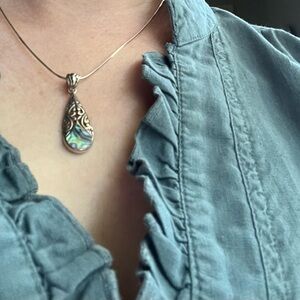 Silver filigree and mother of pearl necklace on silver chain